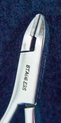 Orthodontic Instrument - small pin and ligature cutter close up image of cutting tips